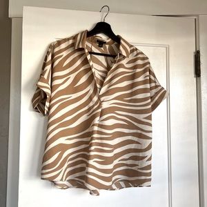 Ann Taylor - Zebra Print Split Neck Shirt 
Size: Medium
Color: Modern Camel